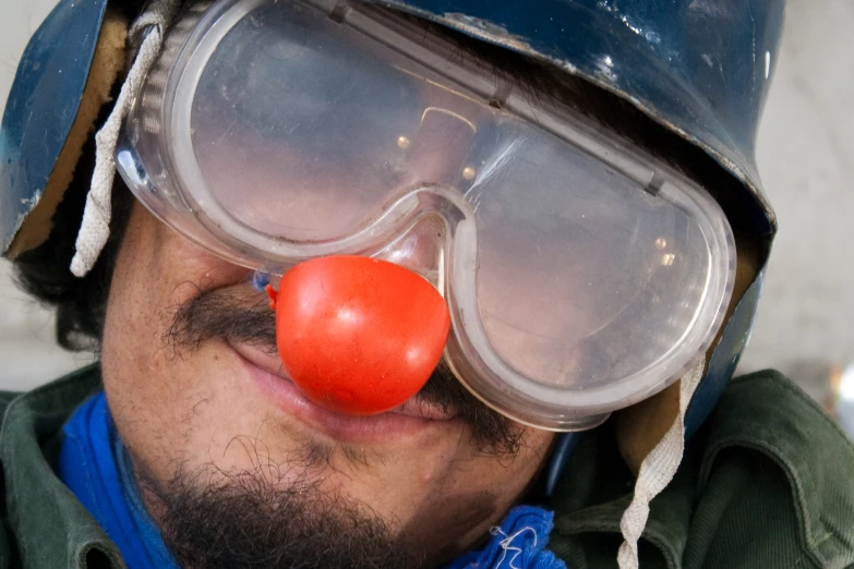 a man wearing a mask and a clown nose