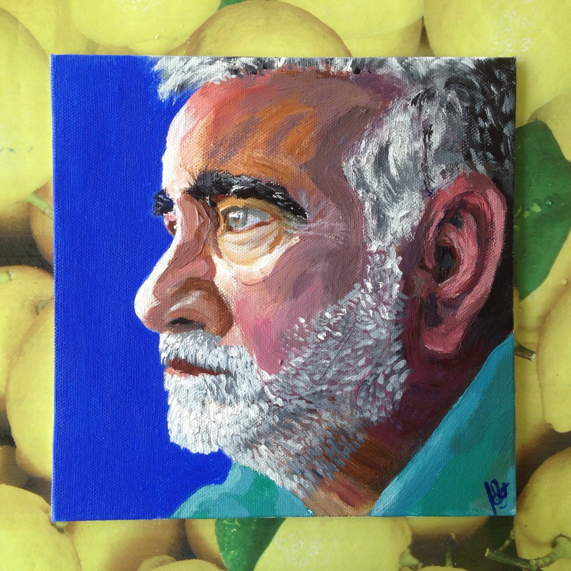 an oil painting of a man's face and shoulders, next to apples