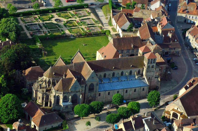 an aerial view of a large castle with several towers