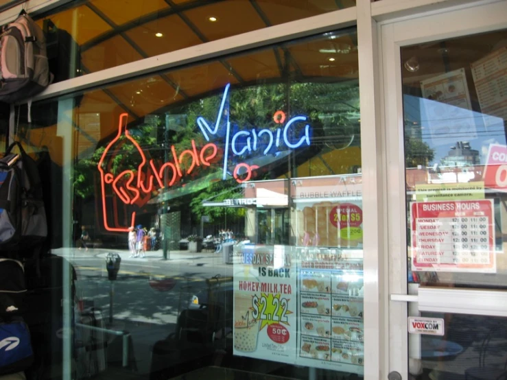 this storefront displays the name of a street vendor