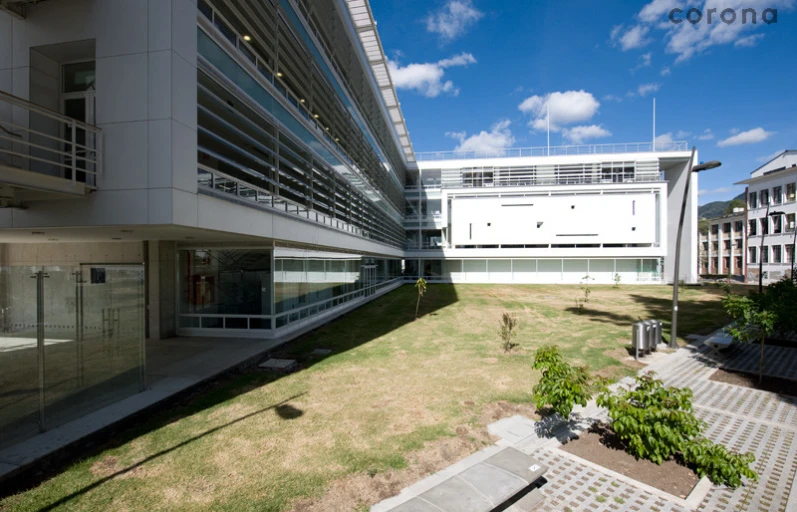 an open courtyard in a building with the roof made out of glass