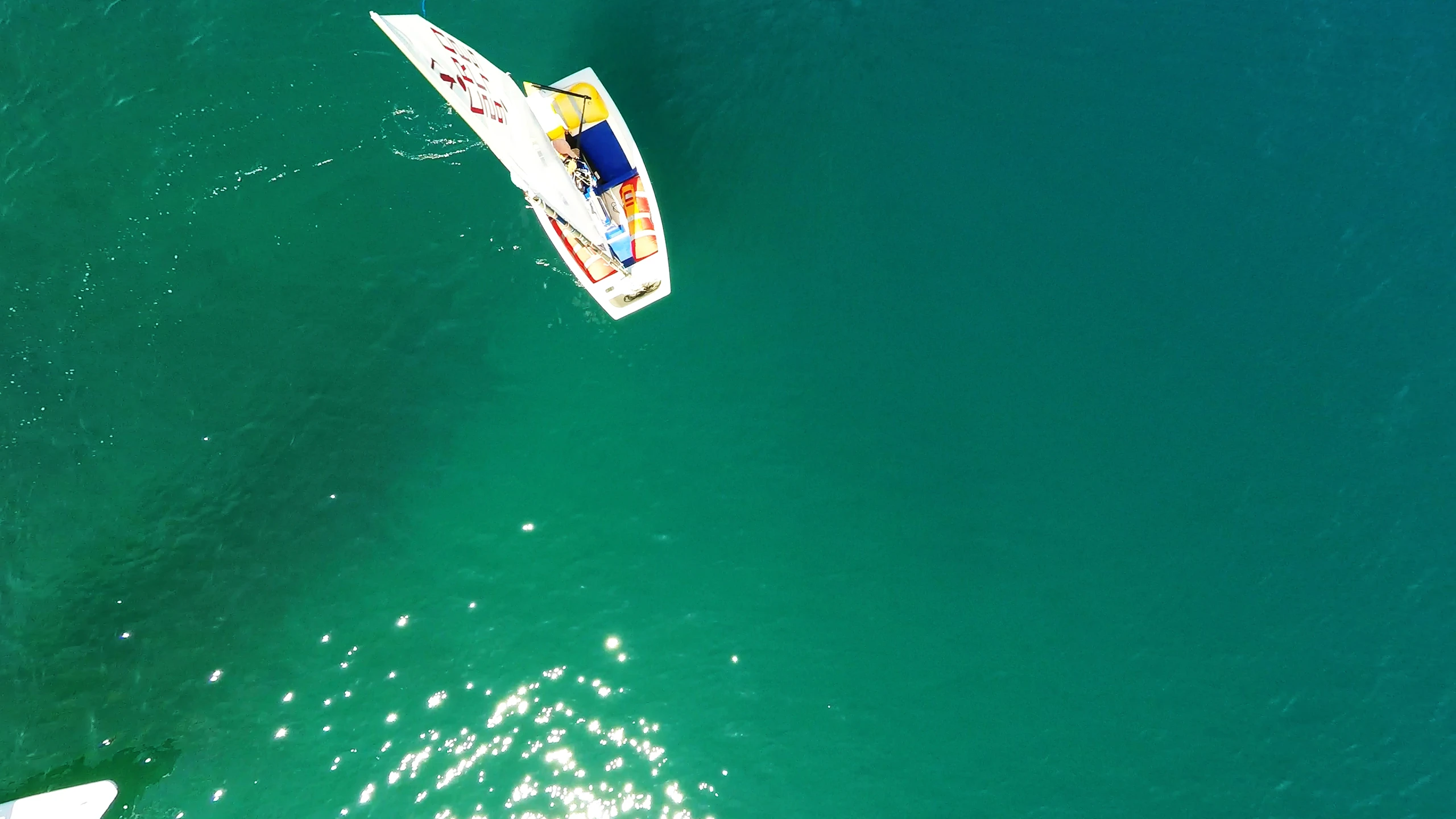 some surfers riding on their surfboards in the ocean