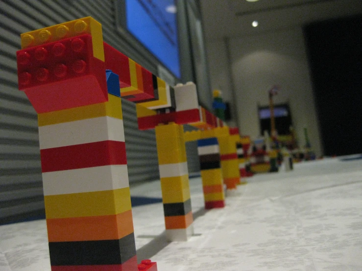 several lego toy standing in a row near each other