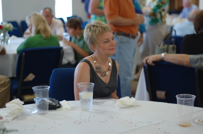 people at the table having drinks and desserts