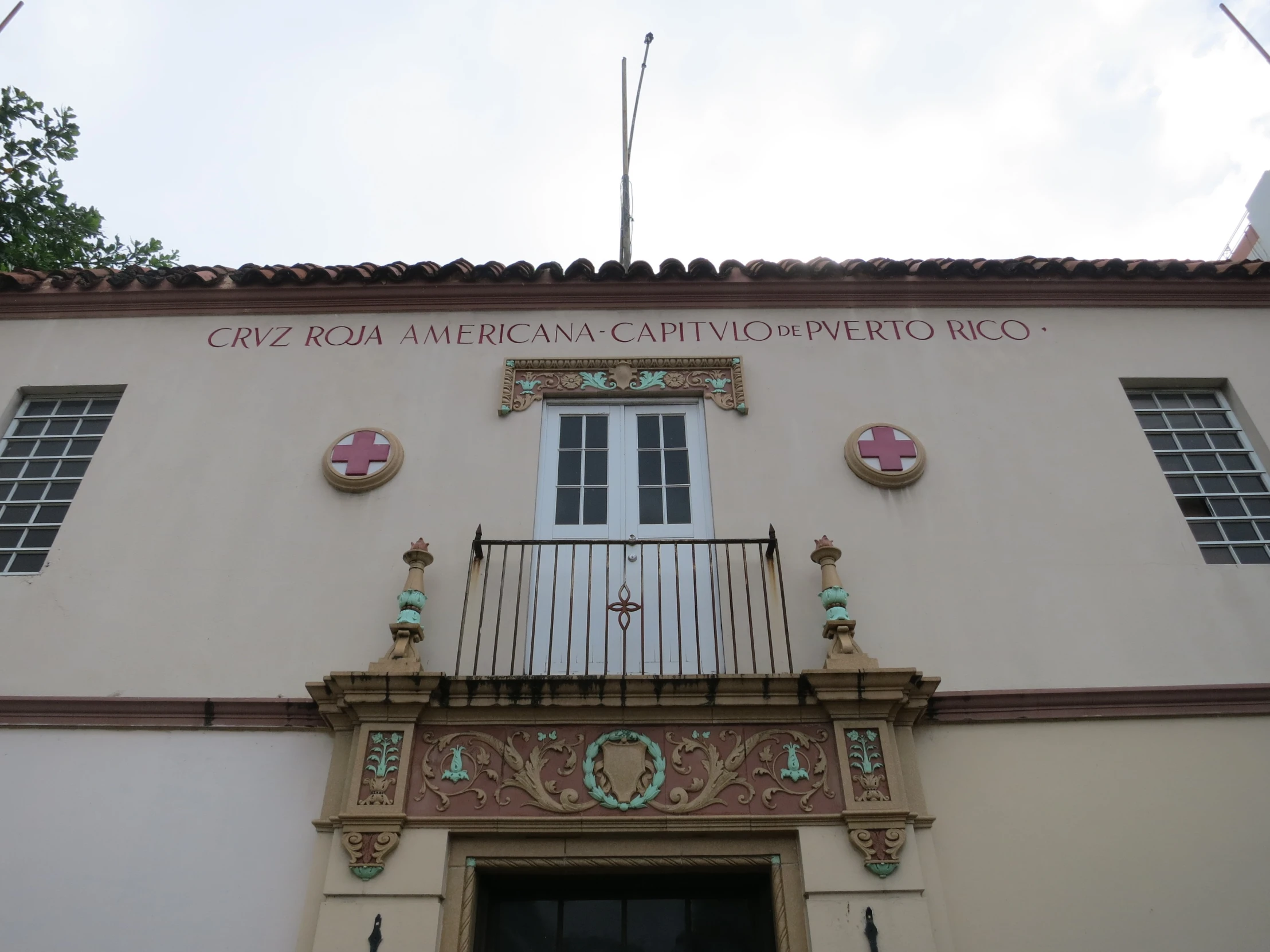 the front of a building with ornate balconies and windows