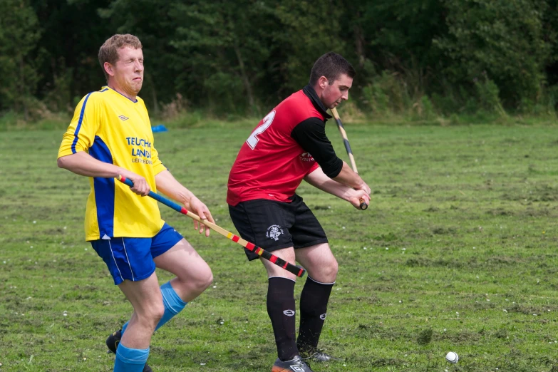 two boys on a field playing tug of war