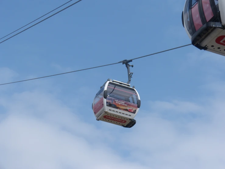 a cable car with two passengers on the side