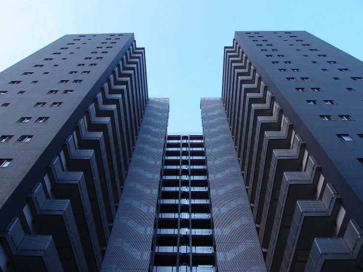 two very tall buildings in between them and one that looks up