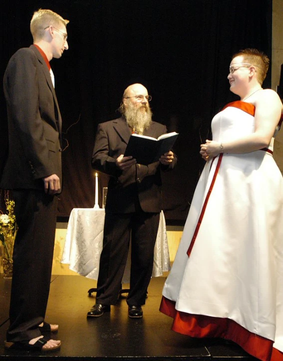 an old man and woman are exchanging vows