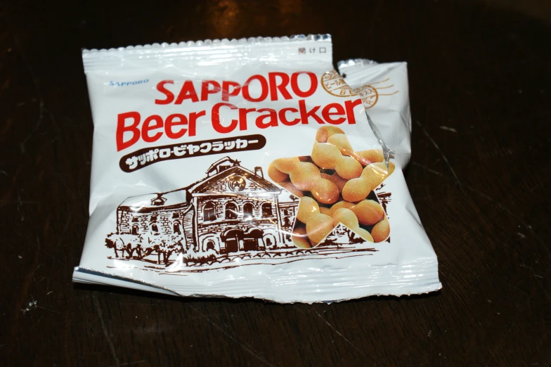 two packets of sapporo beer ers on a table