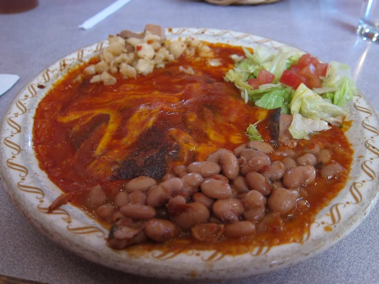 the bowl is filled with different types of food