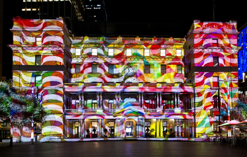 a building is lit up with colorful lights