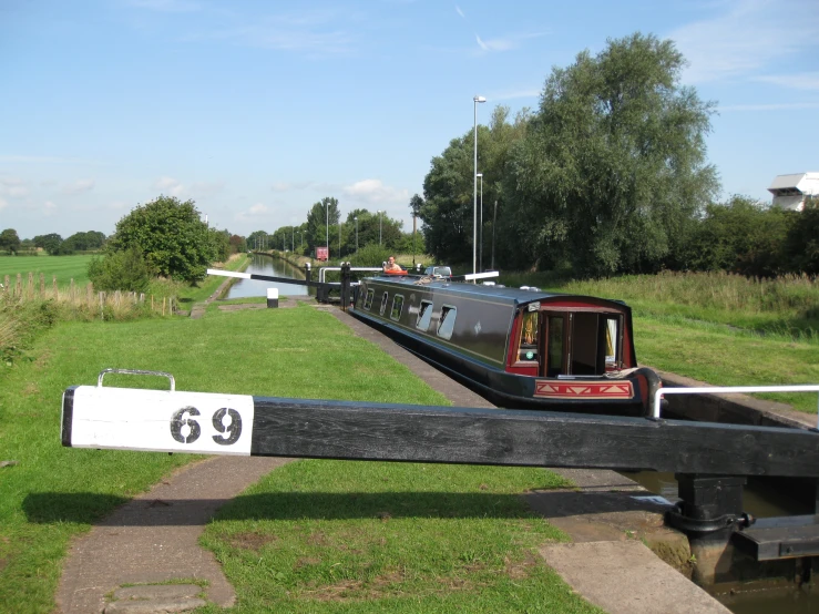 a narrow canal boat entering the lock on the canal