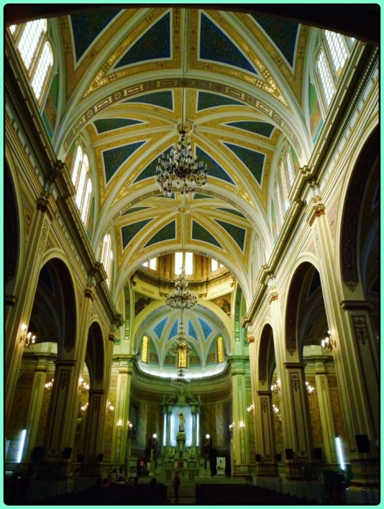 a large, ornate cathedral with chandeliers and vaulted ceiling