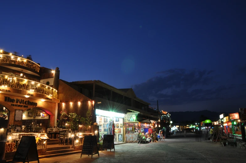 this is a busy street at night with christmas lights