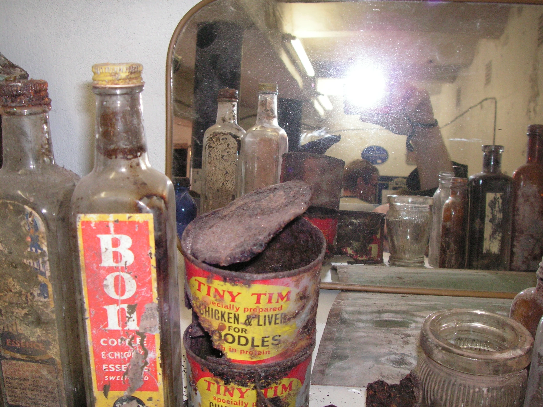 some old items and bottles on a table