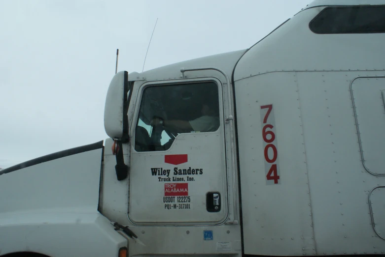 the front door and side view of a white truck