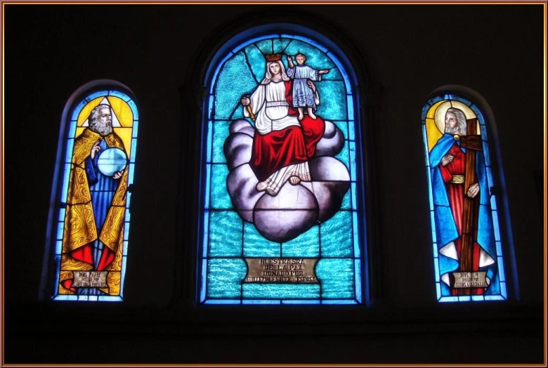 three stained glass windows in a building