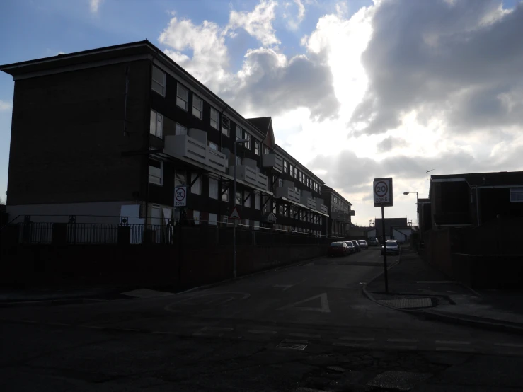 a street with buildings that are standing in the middle of it