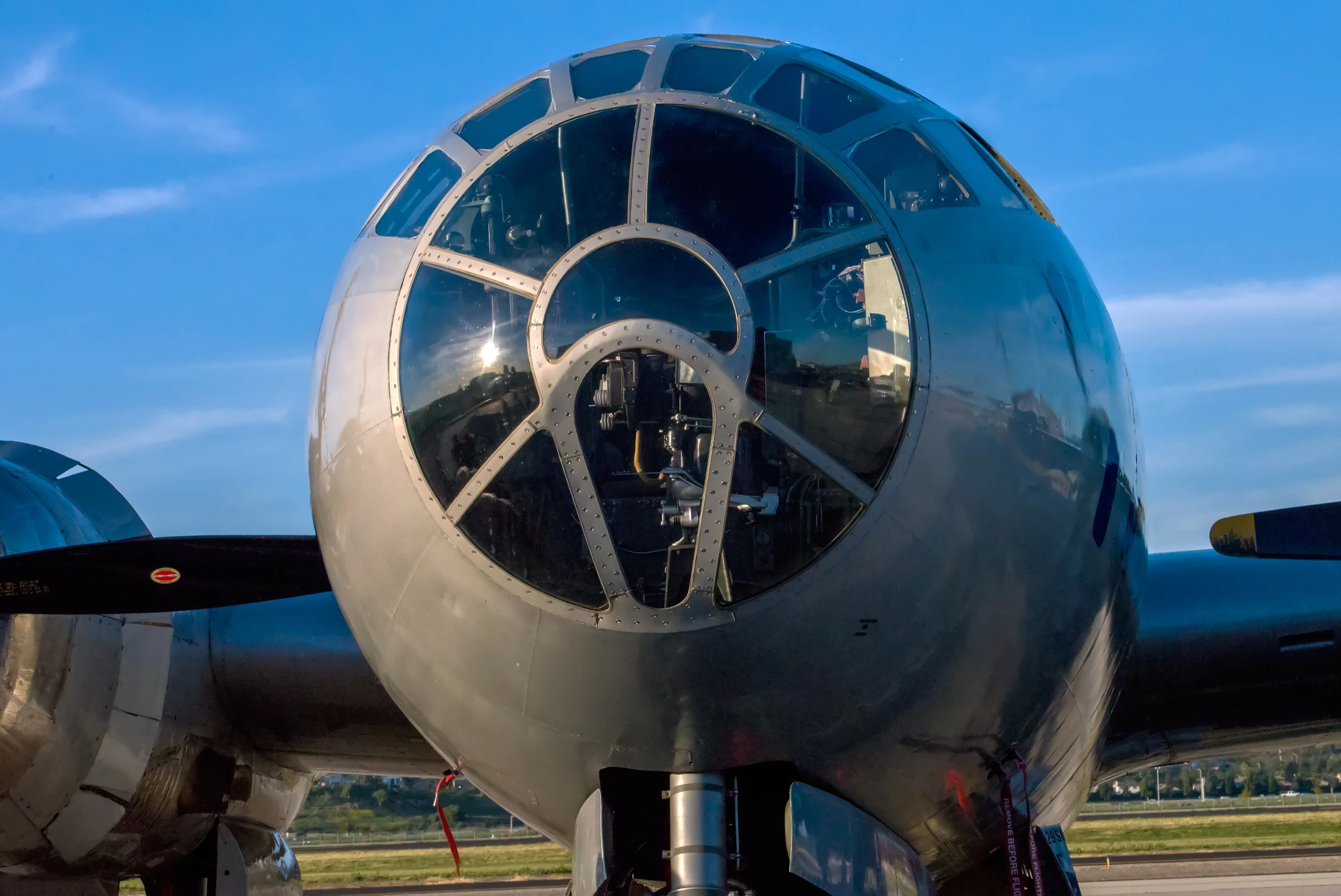 a large metal airplane parked on a tarmac