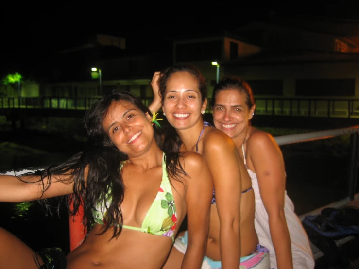 a group of young ladies standing next to each other