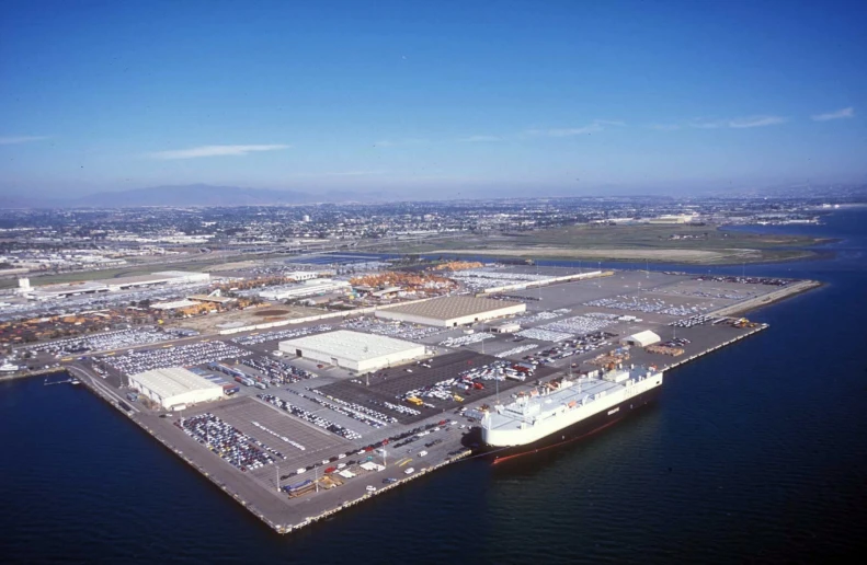 an aerial view of a port area surrounded by a body of water