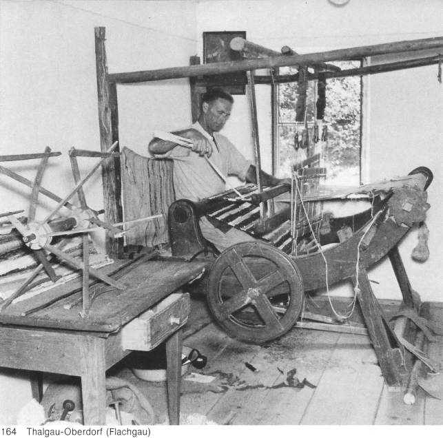 a person working with a computer in a room