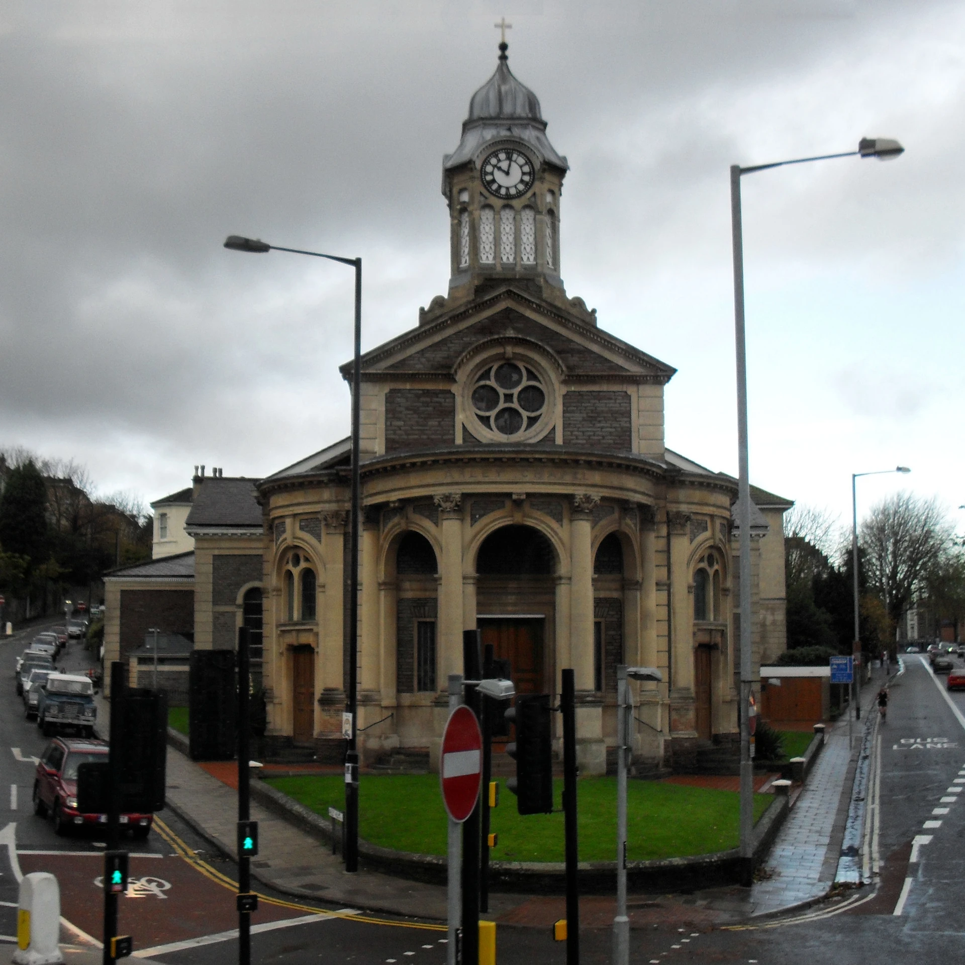 a church on a rainy day with the clock tower