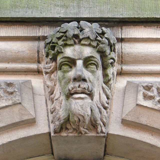 a face carved into the side of a building