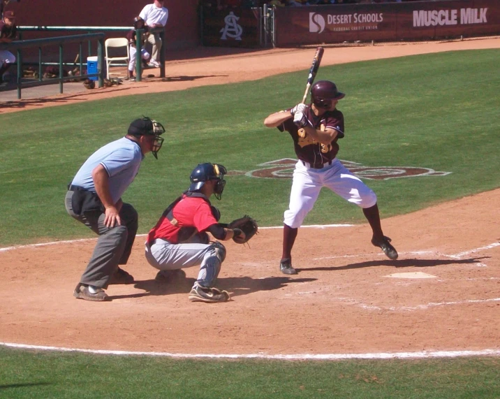 a group of people playing a game of baseball