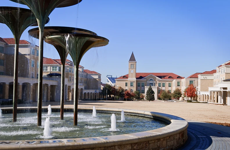 an outside view of a city area with fountains