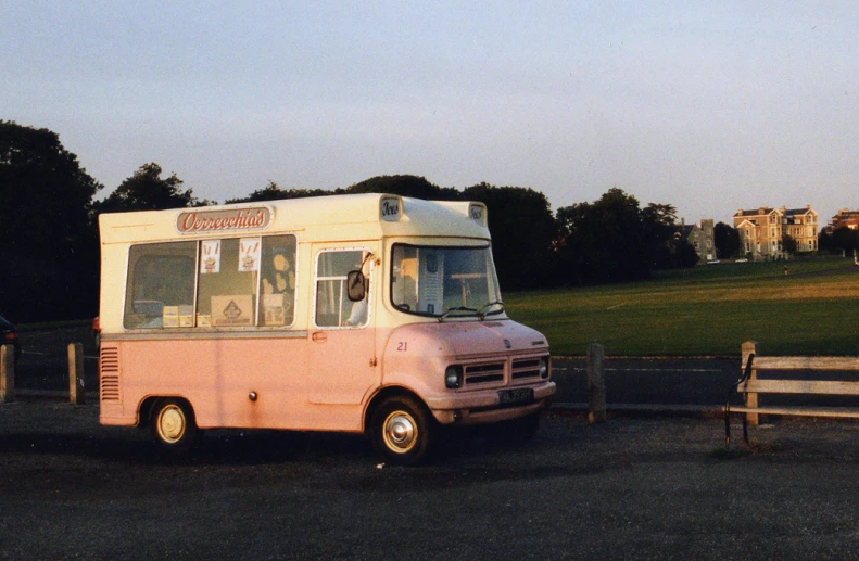 an ice cream truck parked on the side of the road