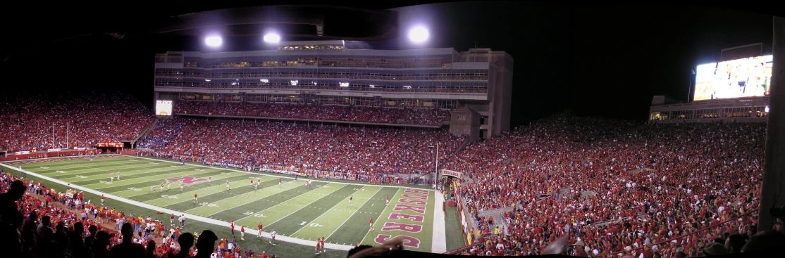 a full stadium filled with fans at night