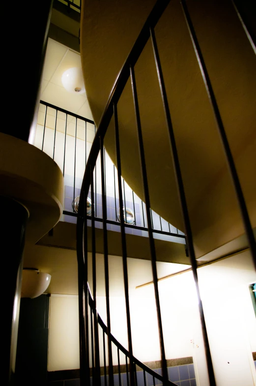 the top of a spiral stair railing in a building