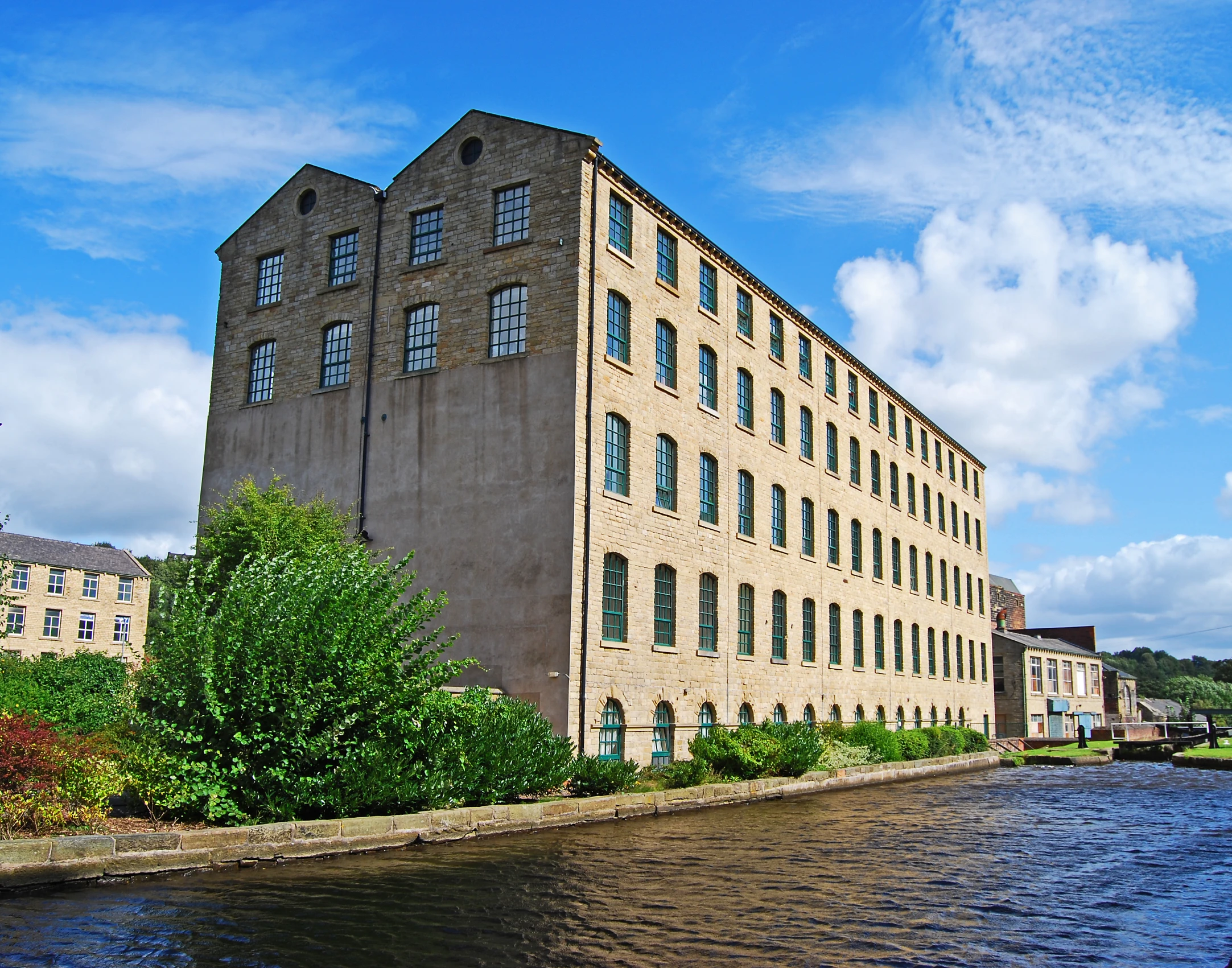 a large building sitting on the side of a body of water