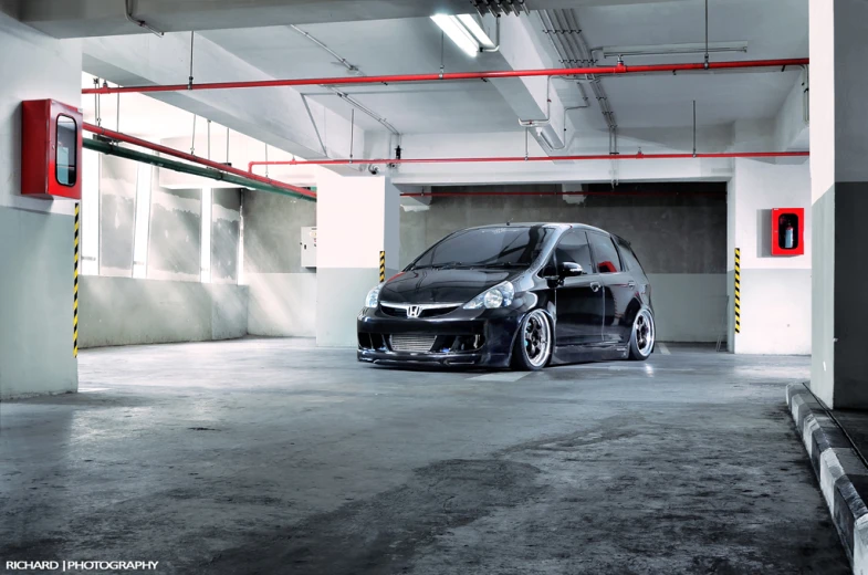 a gray car parked inside of a garage