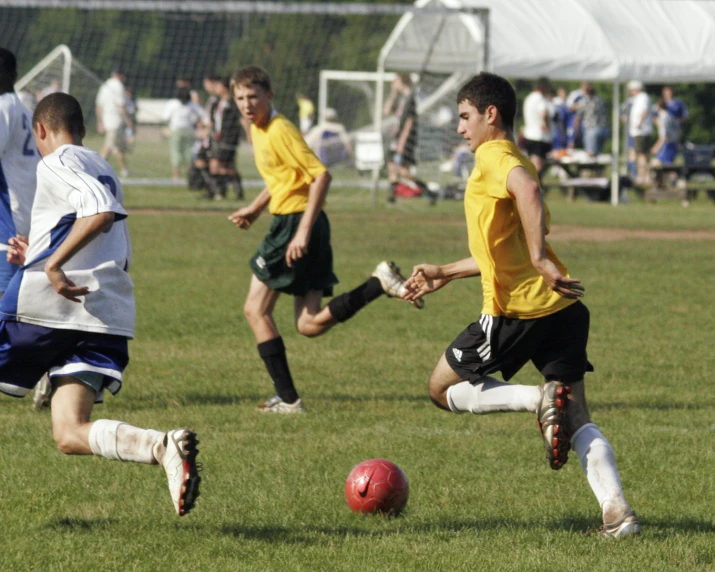 a group of people playing soccer on a field