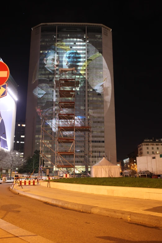 a large building has been decorated with multiple circular images on it