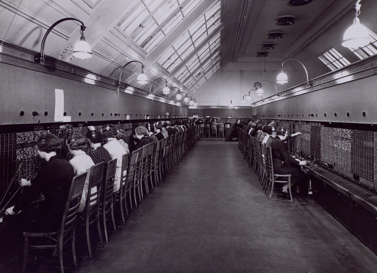 an industrial building with people sitting at tables