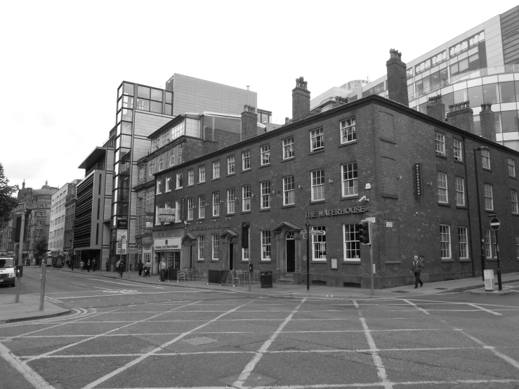 an old brick building in the middle of a wide city