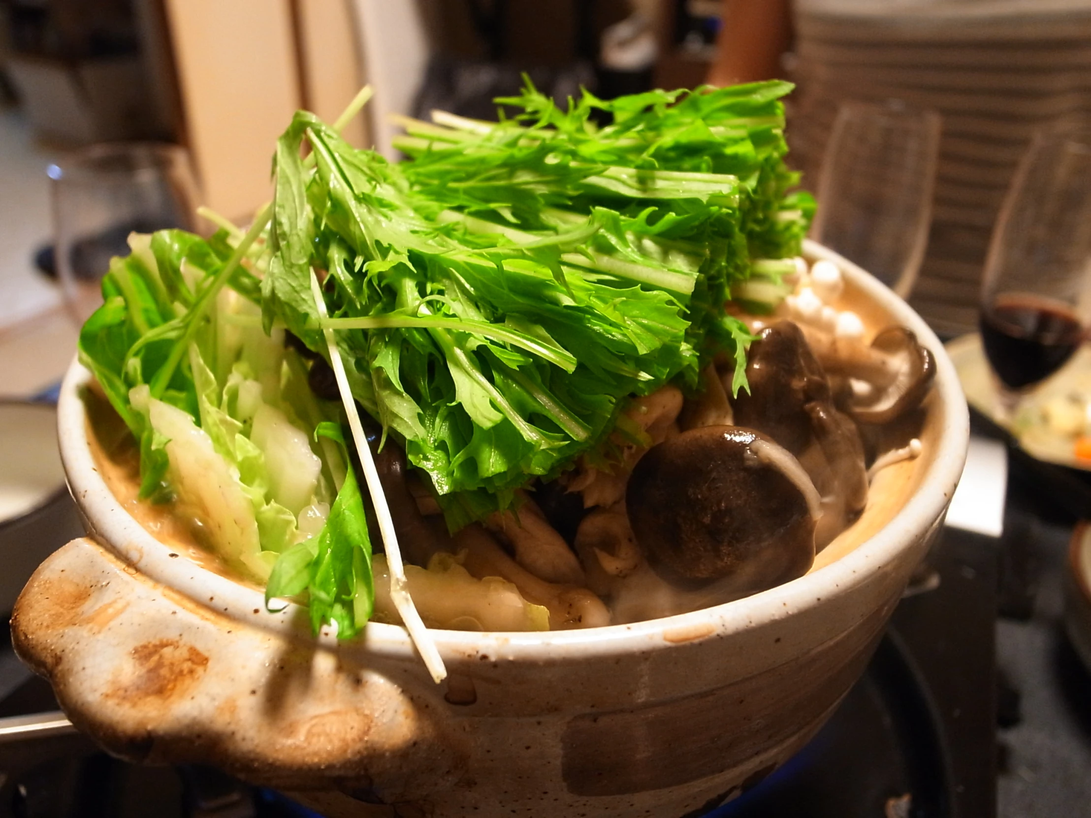 mushroom and lettuce in an open noodle bowl