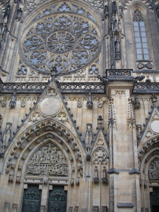 a cathedral door has elaborate carvings all over it