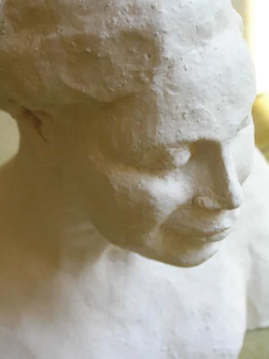 a white sculpture of a person's head