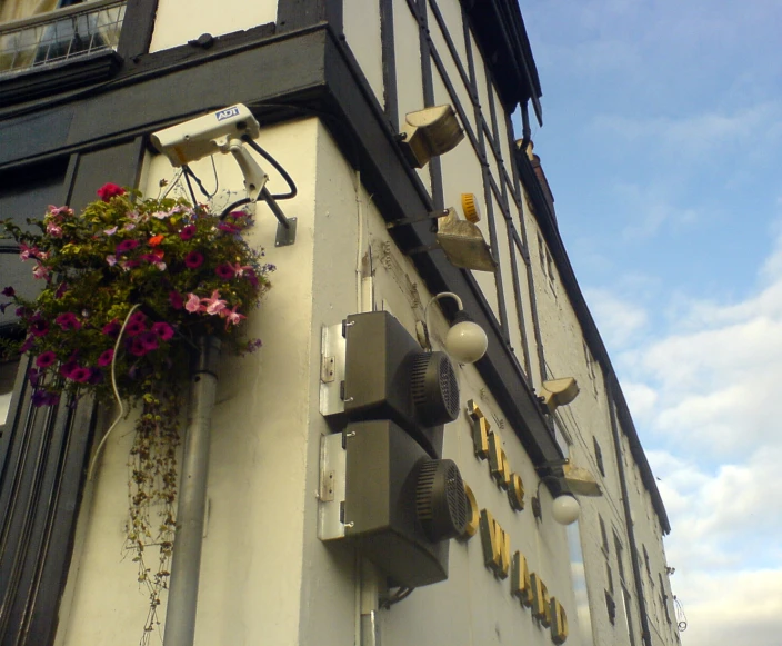 a sign is above an outdoor cafe called the whirlpowers