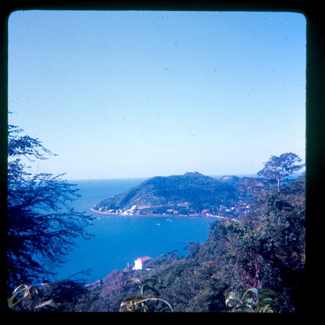 a scenic view overlooking the water from above the mountain