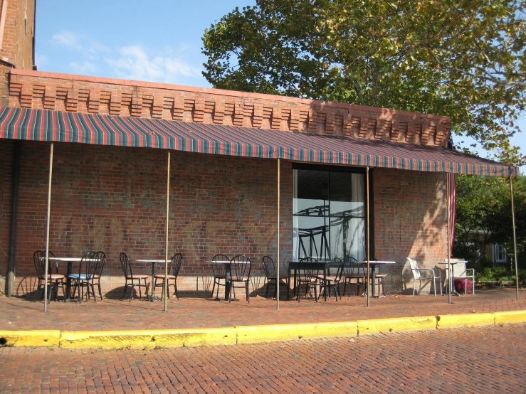 there is a brick patio area at the building