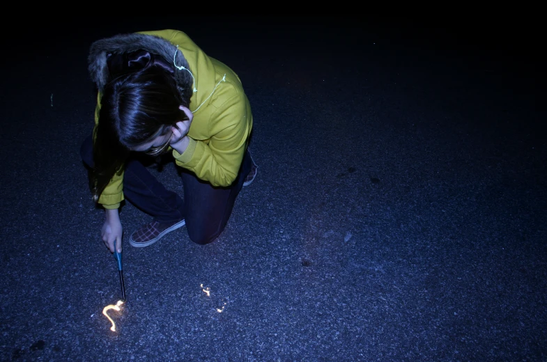 a person is crouched down with a string