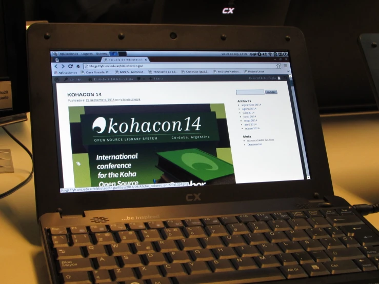 a laptop computer with the words kolonia on it