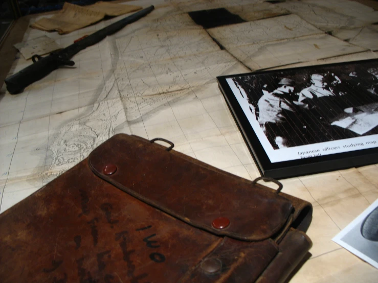 a small brown bag is next to a book