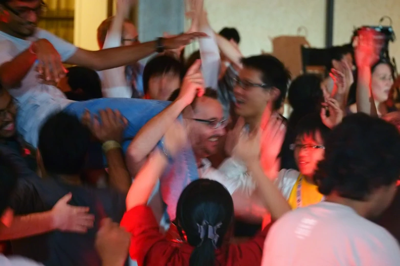 a group of people dancing at a party